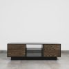 Front view of modern black TV stand with wood veneer doors and open middle shelves, ideal for living room entertainment setup.