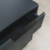 Close-up of a dark grey pedestal drawer with a sleek matte finish and modern handle detail.