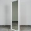 White standing mirror with clean wooden frame, modern free-standing full-length mirror for bedroom, hallway, or dressing area.