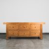 Rustic modern 6-drawer sideboard in a natural oak finish with soft-close drawers and black metal handles.